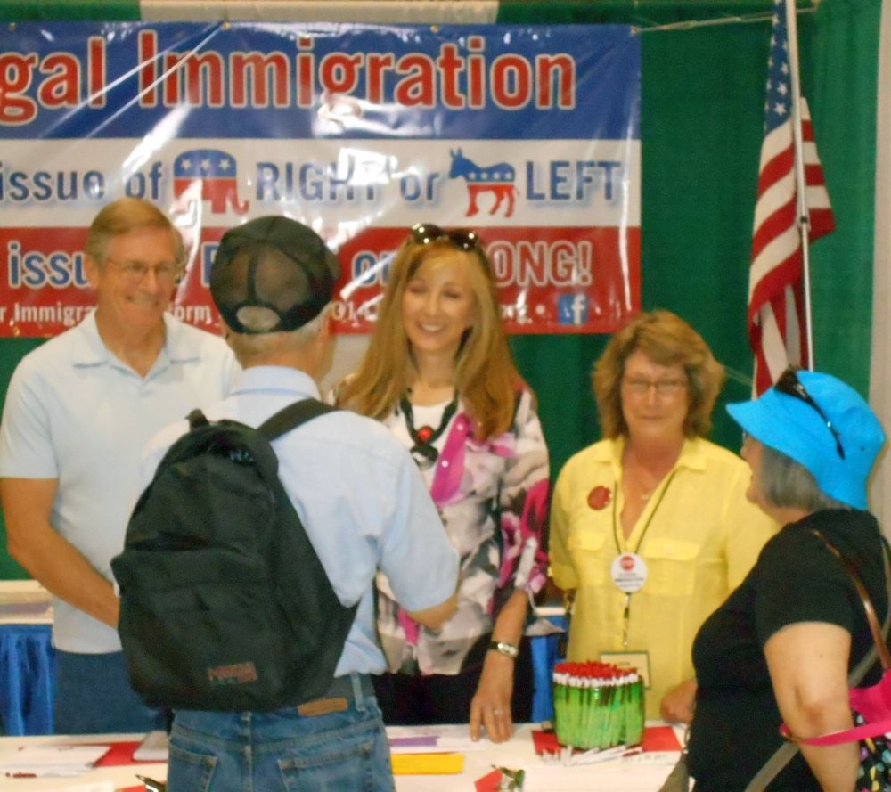 State Senator Kim thatcher, Arnold Toller and OFIR Prsident Cynthia Kendoll chat with fair visitors