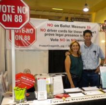 Candidate Greg Barreto and wife Chris volunteer in the booth