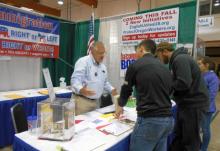 State Rep. and OFIR Board member Mike Nearman helps out in the OFIR booth