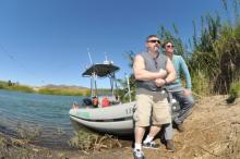 Steven Camarota - and John Wahala, both with CIS pose near a Border Patrol boat.